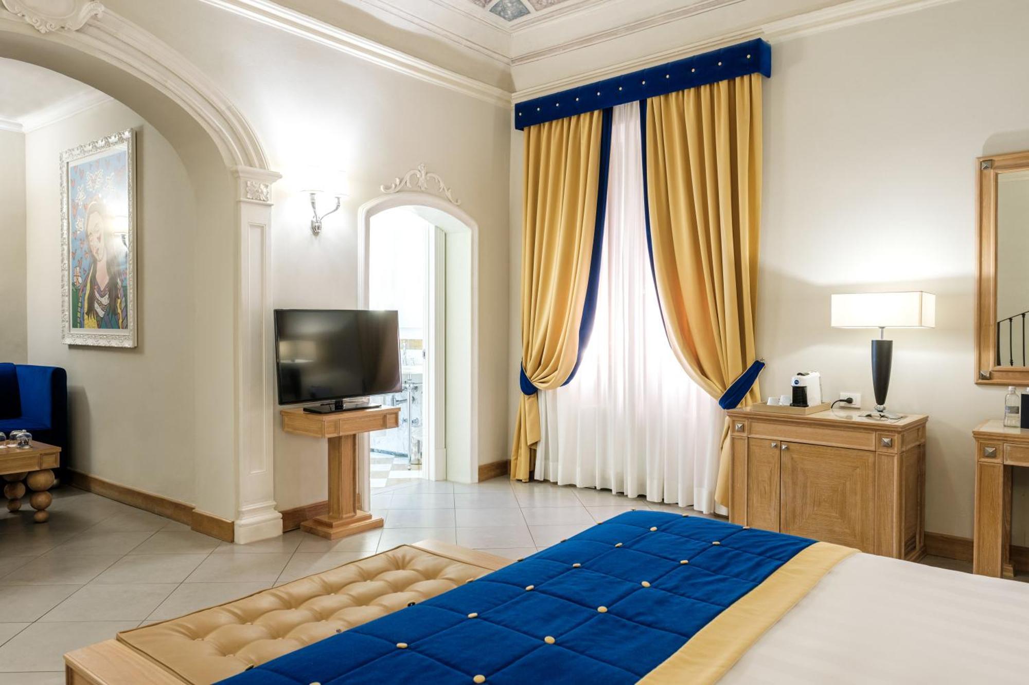 Villa Tolomei Hotel & Resort Флоренція Екстер'єр фото A bedroom at the hotel